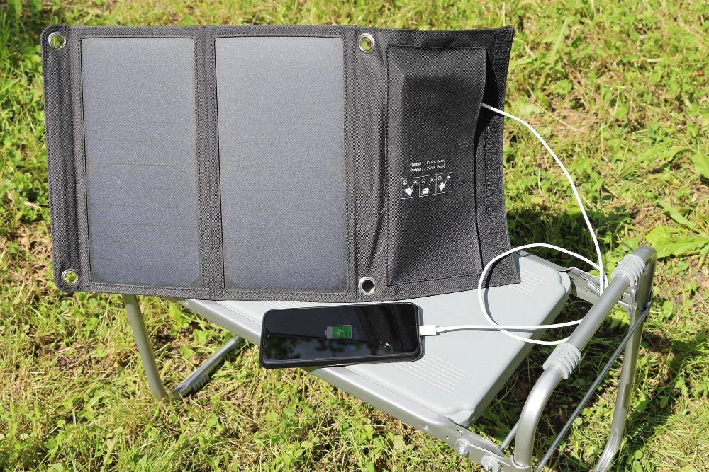 Phone charging and connected to portable solar panels.
