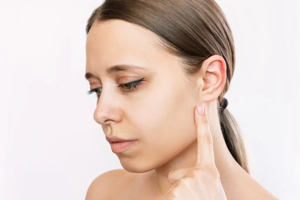 How can otoplasty enhance overall facial balance?