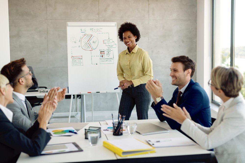 An entrepreneur presents her pitch to a meeting.
