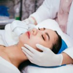 Patient receiving professional skin treatment at an Aesthetics Clinic for smoother, glowing skin