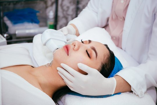 Patient receiving professional skin treatment at an Aesthetics Clinic for smoother, glowing skin