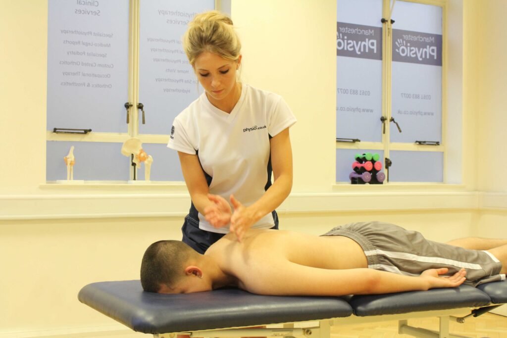 Sports massage Tysons Corner therapist working on client’s back for pain relief and recovery.