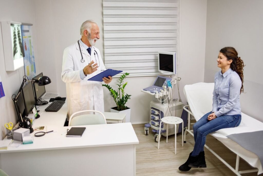 Experienced doctor explaining x-ray results to a female patient