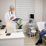 Experienced doctor explaining x-ray results to a female patient