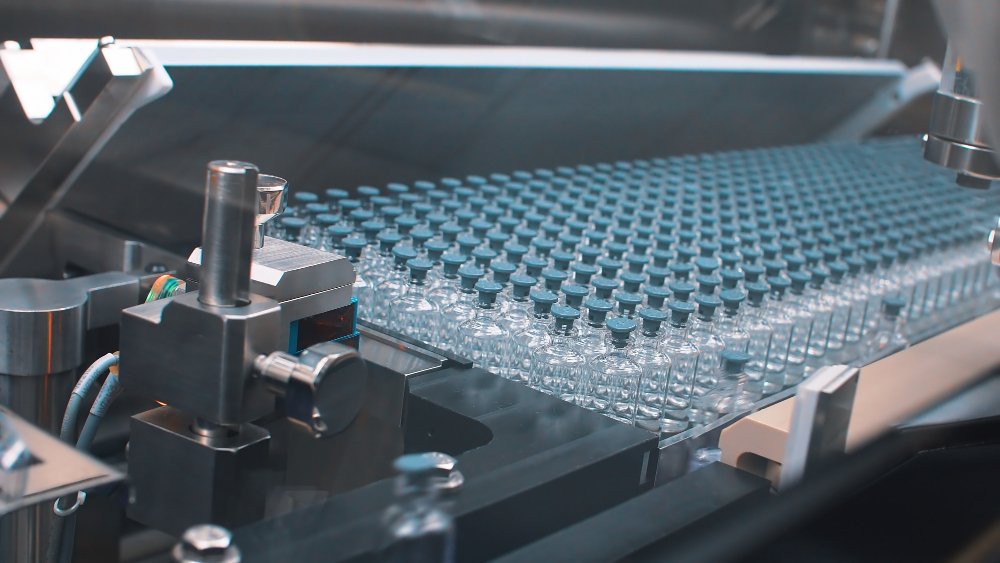 stack of tiny bottles in factory