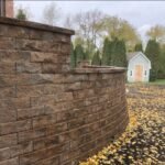 How a Retaining Wall Contractor Handles Difficult Terrain & Sloped Yards